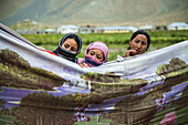 Guests during a Tibetan wedding in Zanskar Valley, Northern India.