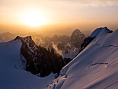 Snowed alpine landscape in the Mont Blanc massif at sunrise