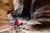 Spain, Canary Islands, Gran Canaria,Las Palmas, a man standing in the canyon of Barranco de Las Vacas (MR)