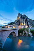 The road bridge of Sisteron by night with the rocher de la Baume in background. Sisteron, Durance valley, Provence, France, Europe.