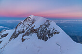 The Aiguille de Bionassay at sunrise from Piton des Italiens along the normal italian way for Mount Blanc. Gonnella refuge, Veny valley, Aosta Valley, Mount Blanc Group; Alps, Italy, Europe.