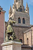 The statue of the Knight Bayard and behind the bell tower of the collegiate church of Sant 'Andrea. Grenoble, Auvergne-Rhône-Alps region, isère department, France, Europe