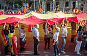 Anti-independence Catalan protestors carry Spanish flag during a demonstration for the unity of Spain on the occasion of the Spanish National Day at Passeig de Gracia, Barcelona on October 12, 2014, Spain