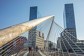 Zubizuri bridge by Santiago Calatrava, and the Isozaki Atea twin towers, Bilbao, Biscay, Basque Country, Spain
