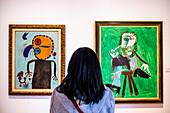 At left `el disco rojo persiguiendo a la alondra´by Joan Miró. At right `Hombre sentado con pipa´by Pablo Picasso, Botero Museum, Bogota, Colombia