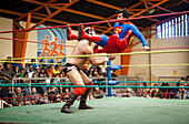 Lucha Libre. Wrestlers in combat, Sports center La Ceja, El Alto, La Paz, Bolivia