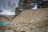 Hiker, Mirador Base Las Torres. You can see the amazing Torres del Paine, Torres del Paine national park, Patagonia, Chile