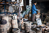 Kohei ishimori is preparing the fire with coal, for baking the molds, to resist the molten iron and make a iron teapot or tetsubin, nanbu tekki,Workshop of Koizumi family,craftsmen since 1659, Morioka, Iwate Prefecture, Japan