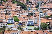 Metrocable or Cable car or gondola lift, H line, public transport, over Comuna 8, Medellín, Colombia