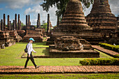 Visitor, in Wat Mahathat, Sukhothai Historical Park, Sukhothai, Thailand