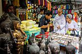 Buddhist nuns searching buddhist amulets, at Amulet market, Bangkok, Thailand.
