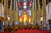 Monks praying, in Wat Chedi Luang temple, Chiang Mai, Thailand
