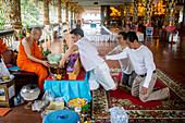 Donation to monks, Wat Suan Dok temple, Chiang Mai, Thailand