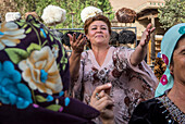 Woman dancing during a folk party, Khiva, Uzbekistan