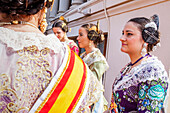 Women in Fallera Costumes,in the roof of town hall, Fallas festival,Valencia