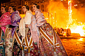 emotionalism during crema,Women of the municipal court of honor during the burning of municipal Falla, Valencia, Spain