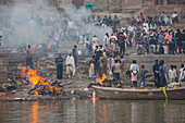 Harishchandra Ghat, a burning ghat, on the banks of Ganges river, Varanasi, Uttar Pradesh, India.