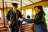 Inspector and traveller, Llanfair and Welshpool Steam Railway, Wales