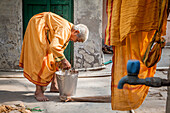 Window washing clothes on the street, facing the room where resides, Vrindavan, Mathura district, India