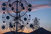 Wind sculpture on public roadway at sunset Cesar Manrique,Tahiche Lanzarote Canary Islands Spain