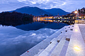 View of the small town of Mergozzo and Lake Mergozzo during blue hour. Verbano Cusio Ossola, Piedmont, Italy.