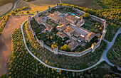 Aerial view of the medieval town of Monteriggioni at sunset. Monteriggioni, Siena district, Tuscany, Italy.