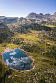 View of the Rifugio Calvi and Lake Rotondo during summer. Carona, Val Brembana, Alpi Orobie, Bergamo, Bergamo Province, Lombardy, Italy, Europe.