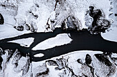 Luftaufnahme der Fjadrargljufur-Schlucht im Winter. Kirkjubæjarklaustur, Sudurland (Südisland), Island, Nordeuropa.