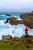 View of the Enys Dodnan Arch at Land's End. Penzance, Western Cornwall, England.