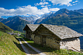 Classic postcard from Bregaglia Valley and Soglio with its mountains. Bregaglia, Maloja district, Switzerland, Europe