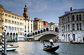 Venice, Ponte of Rialto in summer with gondola and tourists