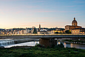 Europe, Italy, Florence: the dawn colors the Lungarno with gold