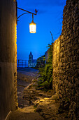 Europe, Italy, Liguria: a glimpse of San Pietro's church while walking at night in Portovenere