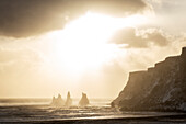 Europe, Iceland: rock pillars of Reynisdrangar kissed by the sun