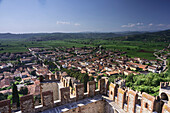 Panoramic photo of Soave town on the tower of the Scaligero Castle of soave, with laces of the tower in the foreground during the day Soave, Verona, Veneto, Italy, Europe, south Europe
