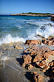 Waves hit the rocks in Cala Varques in Mallorca, Spain