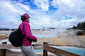 Young woman in Norris Geyser Basin, Yellowstone National Park, USA