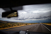 View of stormy clouds from inside car, Yellowstone, USA