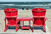 Red beach chair on the beach of saint louis lagoon, kouchibouguac national park, new brunswick, canada, north america
