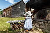Bread oven in front of the cyr house built in 1852, historic acadian village, bertrand, new brunswick, canada, north america