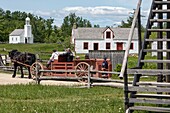 Period cart for taking tourists around the village, blachall built in 1840 and the chapel built in 1831, historic acadian village, bertrand, new brunswick, canada, north america