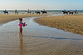 Horseback riding on the beach of cabourg, cote fleurie, calvados, normandy, france