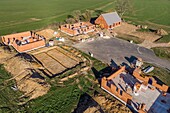 Housing development of individual homes under construction gaining ground over the farmlands, rugles, eure, normandy, france