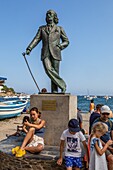 Statue of salvador dali (1904-1989) in front of the beach in the village where he lived cadaques, costa brava, catalonia, spain