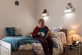 Resident in her individual room, care home for adults with mental disabilities, residence la charentonne, adapei27, association departementale d'amis et de parents, bernay, eure, normandy, france