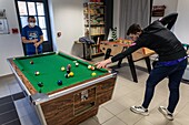 A game of billiards, care home for adults with mental disabilities, residence la charentonne, adapei27, association departementale d'amis et de parents, bernay, eure, normandy, france