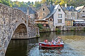 Electric boat ride on the rance beneath the old bridge, medieval town of dinan, cotes-d'amor beneath the viaduc, brittany, france