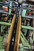 Needles on the bobbins, stitching on the rolls of fabric before packaging, manufacture bohin, saint-sulpice-sur-risle, orne, normandy, france