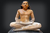 Seated scribe, painted limestone statue from the 5th dynasty, literate bureaucrat of encient egypt known for the art of writing and arithmetic, egyptian museum of cairo devoted to egyptian antiquity, cairo, egypt, africa