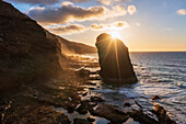 Roque Del Moro rock formation lit by sunset, Cofete beach, Jandia peninsula, Fuerteventura, Canary Islands, Spain